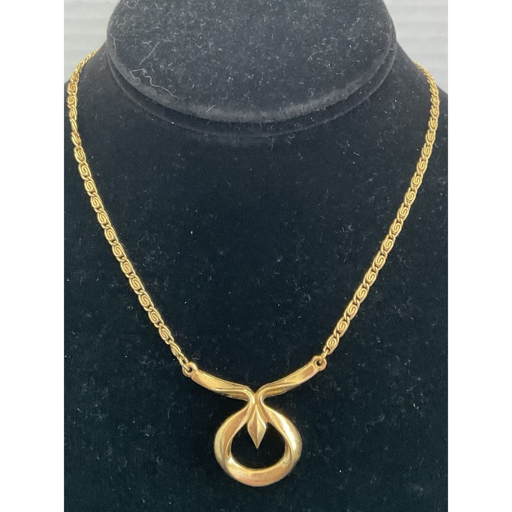 vintage Crown Trifari gold-tone pendant necklace with a modernist twisted knot